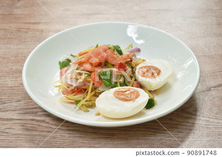 boiled spicy salty egg half cut with dry shrimp and ginger salad on plate 90891748