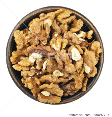 Plate with tasty walnuts isolated on a white background, close up. Top view. Plate with tasty walnuts isolated on a white background, close up. Top view. 90892793