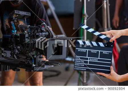 Man hands holding movie clapper. 90892804