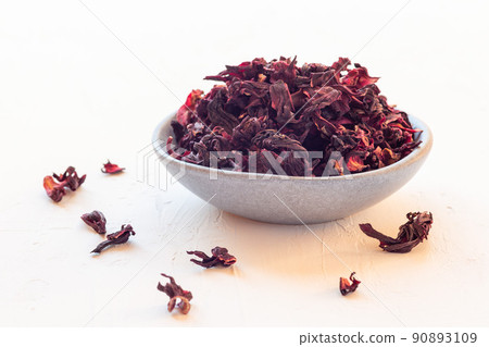 Karkade or hibiscus red tea leaves on a plate, horizontal 90893109