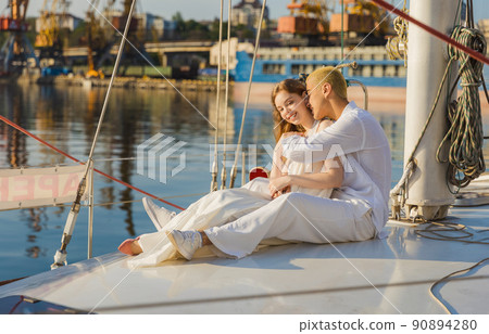 couple sitting on a yacht 90894280