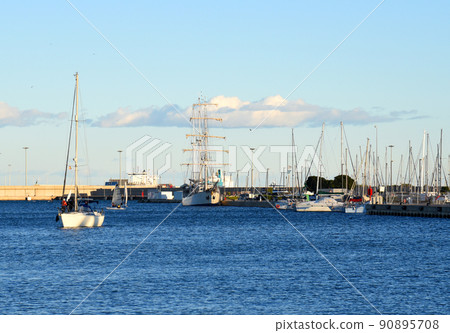 Yachts and motor boats in La Marina de Valencia, Spain. 90895708