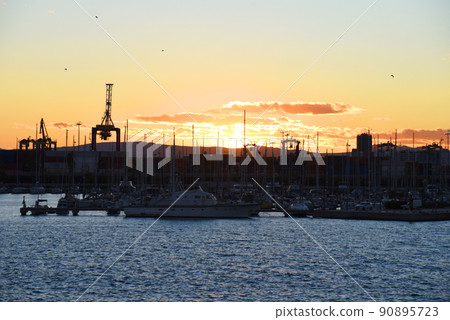Silhouette of yachts and boats on sunset in the in La Marina de Valencia. 90895723