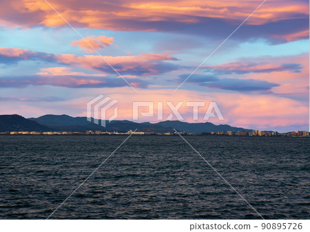 Coastline on sunset. Coast and seashore. Mediterranean sea at Port Saplaya in Valencia. Coastline on sunset. Coast and seashore. Mediterranean sea at Port Saplaya in Valencia. 90895726