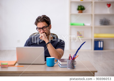 Young male designer working in the office Young male designer working in the office 90896053
