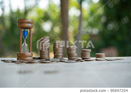 clock and a pile of golden coins on the table, Concept of opportunity clock and a pile of golden coins on the table, Concept of opportunity 90897204