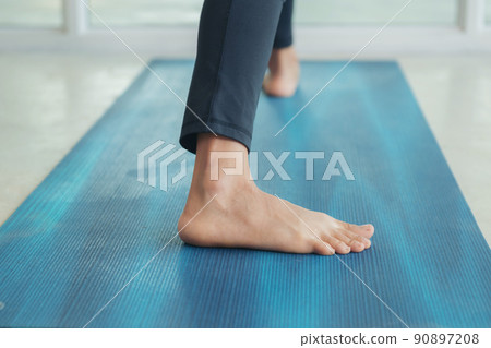 Woman practicing yoga, stretching in anjaneyasana exercise Woman practicing yoga, stretching in anjaneyasana exercise 90897208