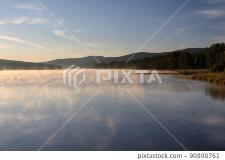 Sunrise over the lake in fog, summer morning, Predni Vyton, Lipno lake, Czech republic 90898761
