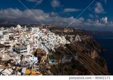 The cityscape of Fira and the Aegean Sea on the cliffs of Santorini, Greece 90902171