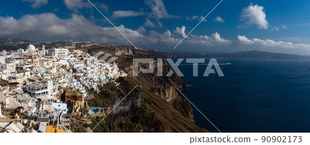 The cityscape of Fira and the Aegean Sea on the cliffs of Santorini, Greece 90902173