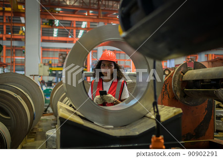 Foreman or worker work at factory site check up machine or products in site. 90902291