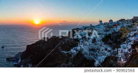 Superb view of the magic hour seen from Oia Castle in Oia, Santorini, Greece 90902568