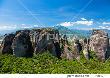 Rocky mountains on the cliffs of Meteora, Greece and the Pindus mountains behind 90903288