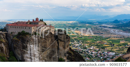 The monastery of St. Stephanos and the cityscape of Kalambaka on the rocky cliffs of Meteora, Greece 90903577