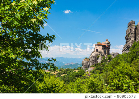 Holy Monastery of St. Nicholas Anapahusas on a rocky mountain on the precipice of Meteora, Greece 90903578