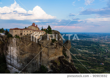 The monastery of Saint Stephanos, the strange rock formations and the cityscape of Kalambaka, which stands on the rocky mountain of the cliff of Meteora, Greece. 90903692