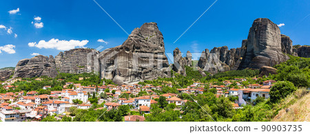 The streets of Kastraki, Greece, the rock formations of Meteora behind, and the Monastery of St. Nicholas Anapahusas The streets of Kastraki, Greece, the rock formations of Meteora behind, and the Monastery of St. Nicholas Anapahusas 90903735