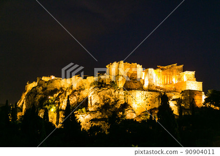 Illuminated Acropolis and Parthenon seen from the Areopagus hill in Athens, Greece 90904011
