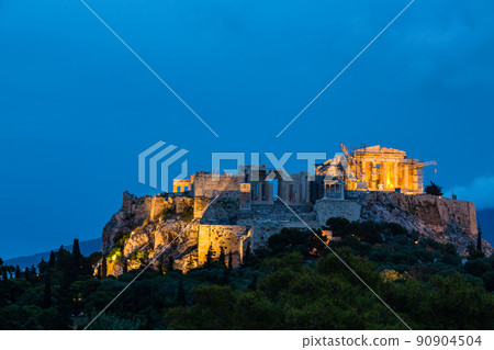 Illuminated Acropolis and Parthenon seen from the Areopagus hills in Athens at dusk, Greece 90904504