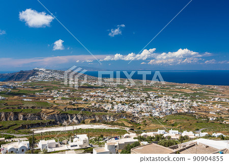 View of the entire island from the hill of the castle ruins of the village of Pilgos on Santorini, Greece 90904855