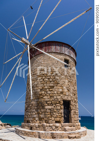 A windmill built at the port of Mandraki in Rhodes, Rhodes, Greece A windmill built at the port of Mandraki in Rhodes, Rhodes, Greece 90905001