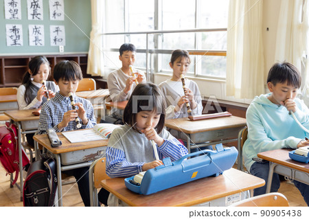Elementary school students taking music classes Elementary school students taking music classes 90905438