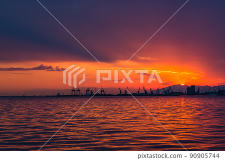 Greece: Terme Bay and Thessaloniki Port seen from the orange sky at sunset and Thessaloniki Greece: Terme Bay and Thessaloniki Port seen from the orange sky at sunset and Thessaloniki 90905744