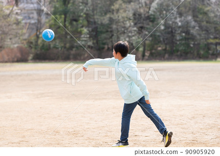 Elementary school students playing dodgeball Elementary school students playing dodgeball 90905920