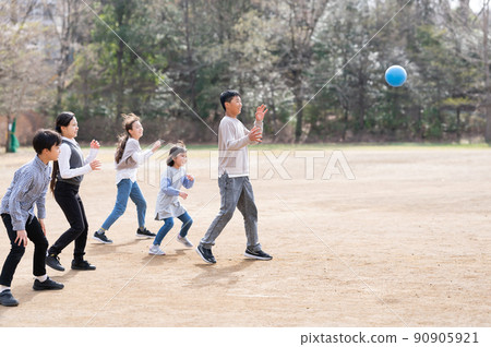 Elementary school students playing dodgeball Elementary school students playing dodgeball 90905921