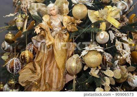 Christmas tree with bright baubles and decorations 90906573