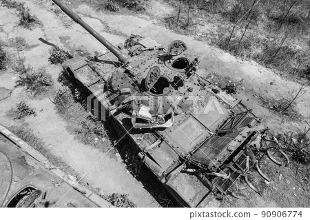 Destroyed military equipment during the war in Ukraine, black and white photo Destroyed military equipment during the war in Ukraine, black and white photo 90906774