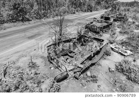 Destroyed military equipment during the war in Ukraine, black and white photo Destroyed military equipment during the war in Ukraine, black and white photo 90906789