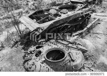 Destroyed military equipment during the war in Ukraine, black and white photo 90906971