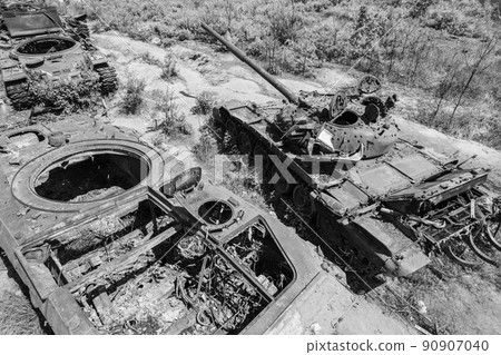 Destroyed military equipment during the war in Ukraine, black and white photo Destroyed military equipment during the war in Ukraine, black and white photo 90907040