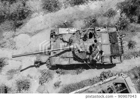 Destroyed military equipment during the war in Ukraine, black and white photo Destroyed military equipment during the war in Ukraine, black and white photo 90907043