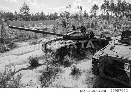 Destroyed military equipment during the war in Ukraine, black and white photo Destroyed military equipment during the war in Ukraine, black and white photo 90907053