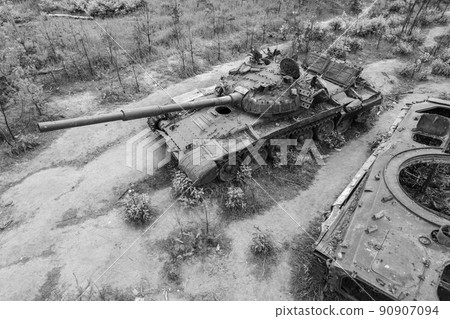 Destroyed military equipment during the war in Ukraine, black and white photo 90907094