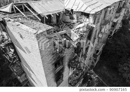 War in Ukraine - destroyed building in Makariv, black and white photo 90907165