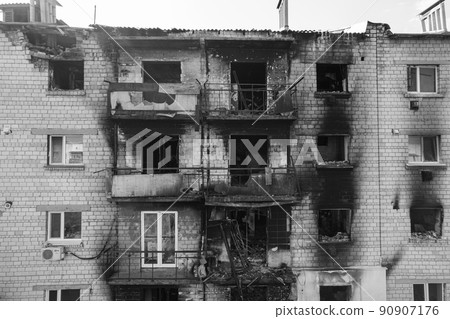 War in Ukraine - destroyed building in Makariv, black and white photo War in Ukraine - destroyed building in Makariv, black and white photo 90907176