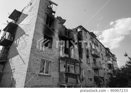 War in Ukraine - destroyed building in Makariv, black and white photo War in Ukraine - destroyed building in Makariv, black and white photo 90907233
