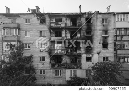 War in Ukraine - destroyed building in Makariv, black and white photo War in Ukraine - destroyed building in Makariv, black and white photo 90907265