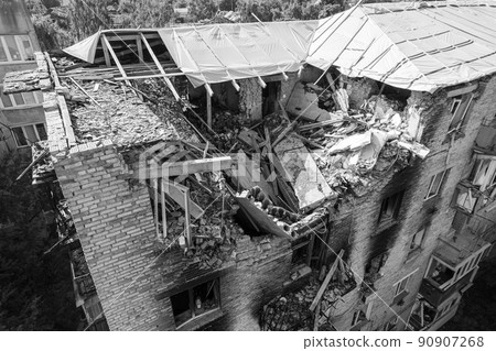 War in Ukraine - destroyed building in Makariv, black and white photo War in Ukraine - destroyed building in Makariv, black and white photo 90907268