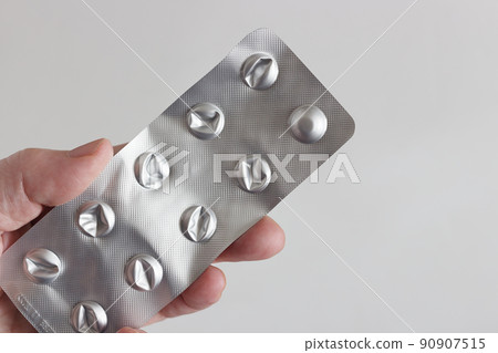 Last pill in blister pack in hand Last pill in blister pack in hand 90907515