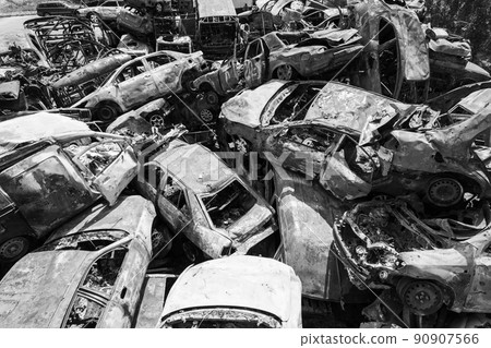 War-destroyed cars in Irpin, Bucha district, Ukraine, black and white War-destroyed cars in Irpin, Bucha district, Ukraine, black and white 90907566