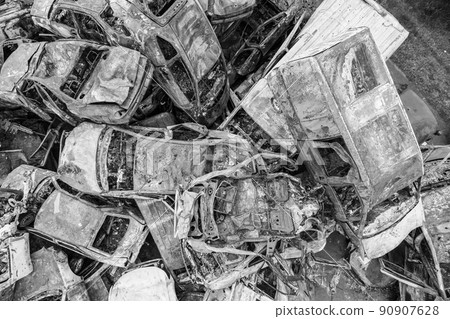 War-destroyed cars in Irpin, Bucha district, Ukraine, black and white War-destroyed cars in Irpin, Bucha district, Ukraine, black and white 90907628