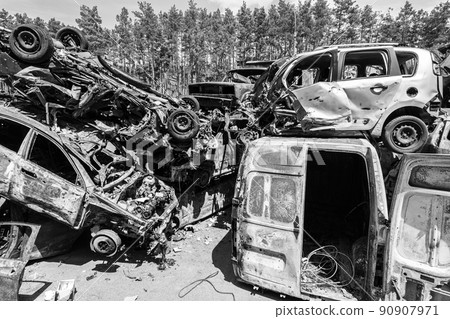 War in Ukraine: a dump of shot and burned cars in Irpin, Bucha district, black and white War in Ukraine: a dump of shot and burned cars in Irpin, Bucha district, black and white 90907971