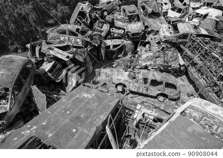 War in Ukraine: a dump of shot and burned cars in Irpin, Bucha district, black and white War in Ukraine: a dump of shot and burned cars in Irpin, Bucha district, black and white 90908044
