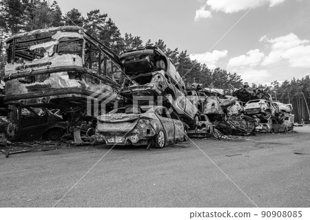 War-destroyed cars in Irpin, Bucha district, Ukraine, black and white War-destroyed cars in Irpin, Bucha district, Ukraine, black and white 90908085