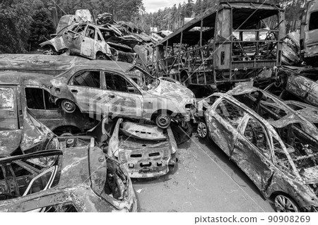 War in Ukraine: a dump of shot and burned cars in Irpin, Bucha district, black and white War in Ukraine: a dump of shot and burned cars in Irpin, Bucha district, black and white 90908269