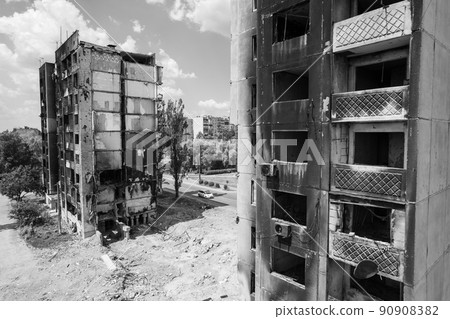 War in Ukraine - destroyed building in Borodyanka, black and white photo War in Ukraine - destroyed building in Borodyanka, black and white photo 90908382